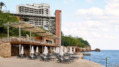 AKRA V HOTEL Pools & Beach