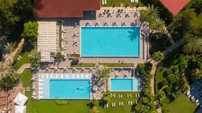 AKRA V HOTEL Pools & Beach