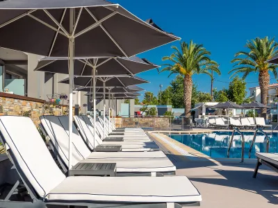 DIONYSOS HOTEL Pools & Beach