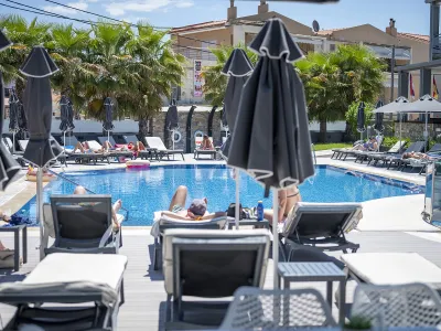 DIONYSOS HOTEL Pools & Beach